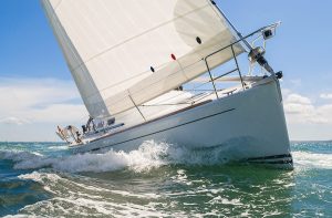 Close up of sailing boat, sail boat or yacht at sea