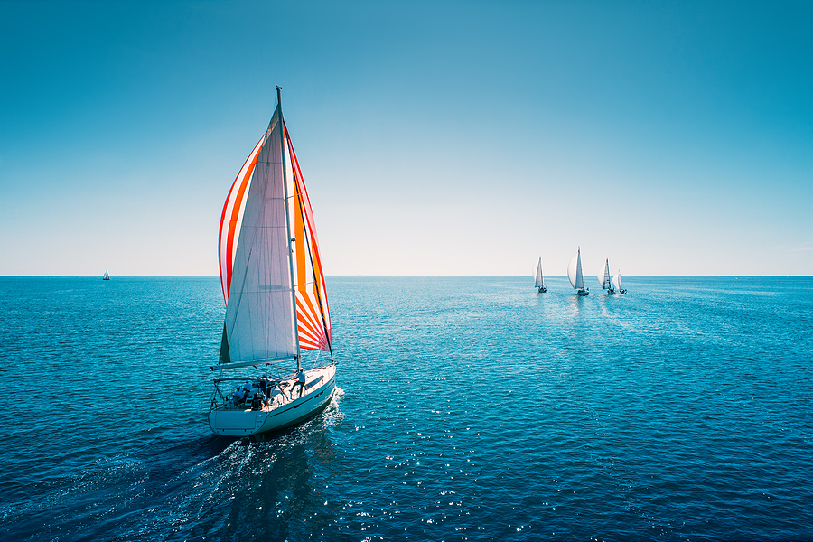 Regatta Sailing Ship Yachts With White Sails At Opened Sea. Aeri